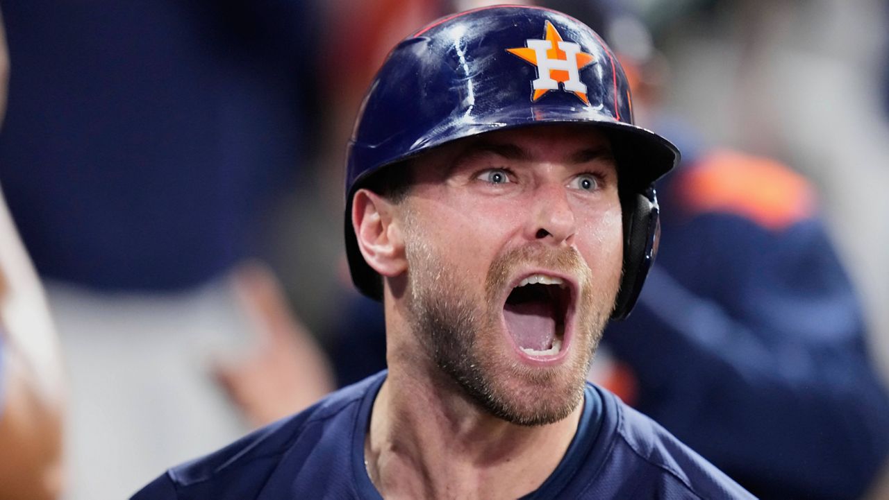 Houston Astros' Cooper Hummel celebrates in the dugout after hitting a home run against the Philadelphia Phillies during the eighth inning of a baseball game Tuesday, June 24, 2025, in Houston. (AP Photo/David J. Phillip)