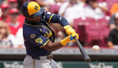 Cincinnati Reds' TJ Friedl catches a fly ball at the wall to end the game in the ninth inning of a baseball game against the Milwaukee Brewers, Tuesday, June 3, 2025, in Cincinnati. (AP Photo/Kareem Elgazzar)