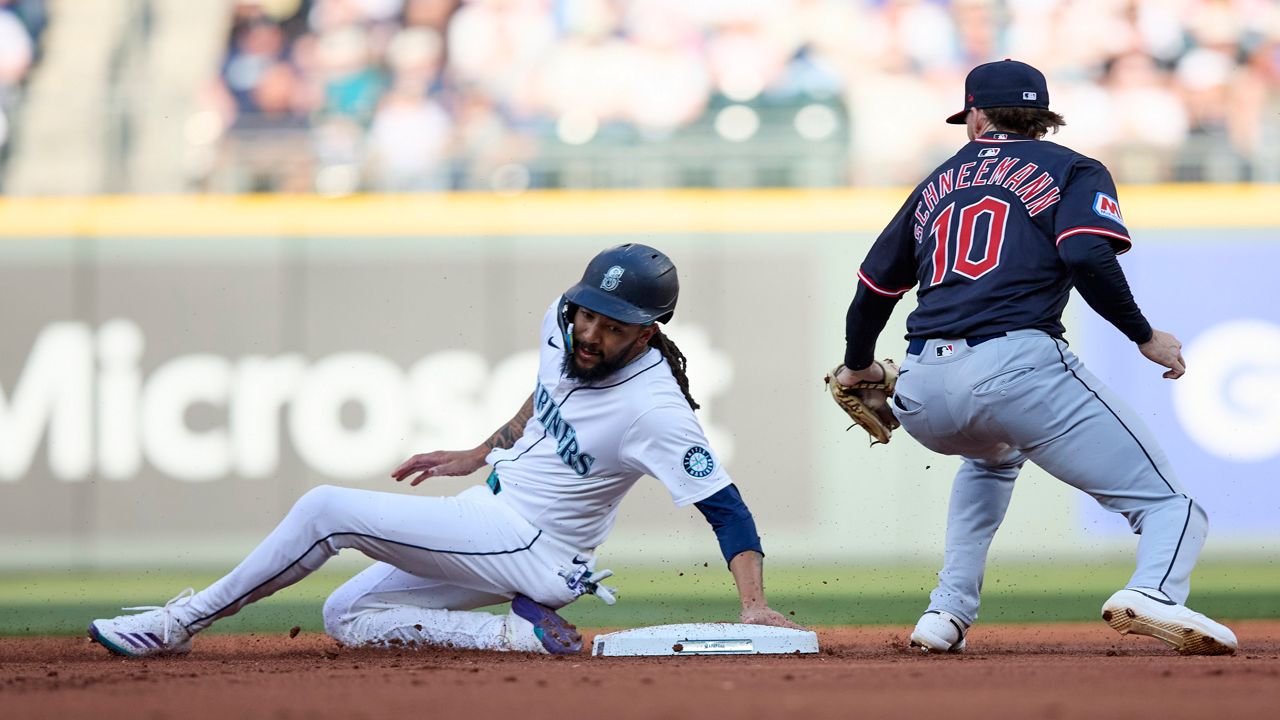 Seattle Mariners' Rowdy Tellez, center, celebrates in the dugout after hitting a solo home run during the fourth inning of a baseball game against the Cleveland Guardians, Friday, June 13, 2025, in Seattle.