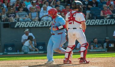 St. Louis Cardinals' Masyn Winn dives back into first base as the ball gets away from Cleveland Guardians first baseman Kyle Manzardo on a pickoff-attempt in the third inning of a baseball game in Cleveland, Friday, June 27, 2025.