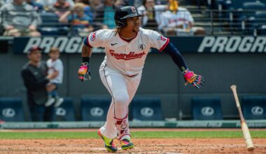 Cleveland Guardians' Jose Ramirez throws to first base but not in time to put out Los Angeles Angels' Logan O'Hoppe during the seventh inning of a baseball game, Friday, May 30, 2025, in Cleveland.