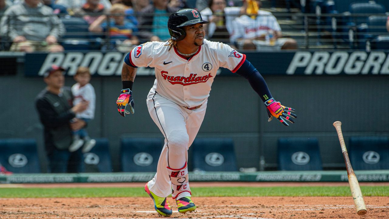 Cleveland Guardians' Jose Ramirez throws to first base but not in time to put out Los Angeles Angels' Logan O'Hoppe during the seventh inning of a baseball game, Friday, May 30, 2025, in Cleveland.