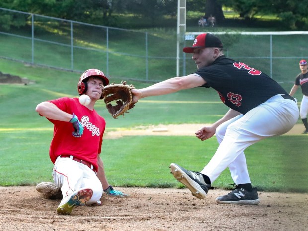 Jay's Jack Reichlin scores on a wild pitch as Barnstormers' pitcher Jack Ellis tries to make the tag in the fourth inning. Tom Silknitter for Daily Local News