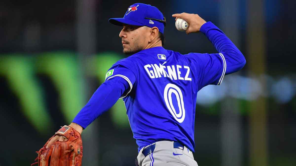 Toronto Blue Jays second baseman Andres Gimenez (0) throws to first for the out against Los Angeles Angels second baseman Luis Rengifo (2) during the fourth inning at Angel Stadium.