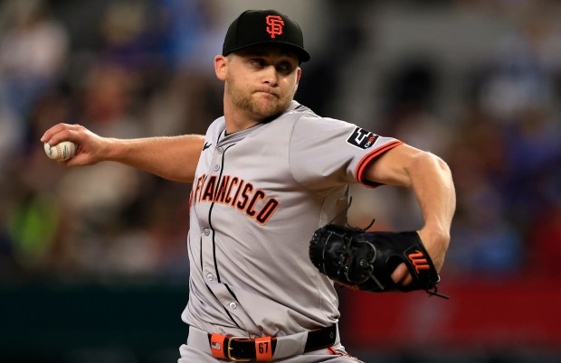Keaton Winn #67 of the San Francisco Giants pitches against the Texas Rangers during the first inning at Globe Life Field on June 9, 2024 in Arlington, Texas. (Photo by Ron Jenkins/Getty Images)