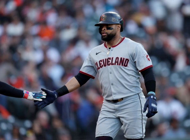 Cleveland Guardians' Carlos Santana #41 is congratulated after scoring on a three-run home run by Cleveland Guardians' Daniel Schneemann #10 in the third inning of their MLB game against the San Francisco Giants at Oracle Park in San Francisco, Calif., on Wednesday, June 18, 2025. (Jane Tyska/Bay Area News Group)