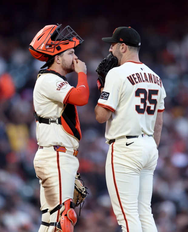 San Francisco Giants starting pitcher Jason Verlander #45 talks with...