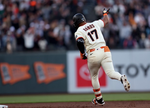 San Francisco Giants’ Heliot Ramos #17 celebrates as he rounds...