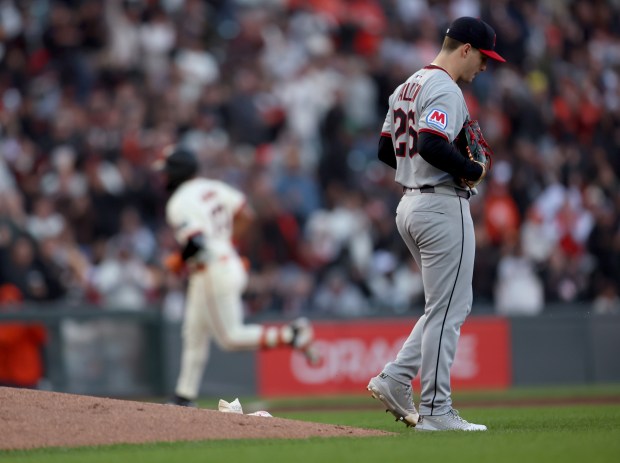 Cleveland Guardians starting pitcher Logan Allen #26 reacts after giving...