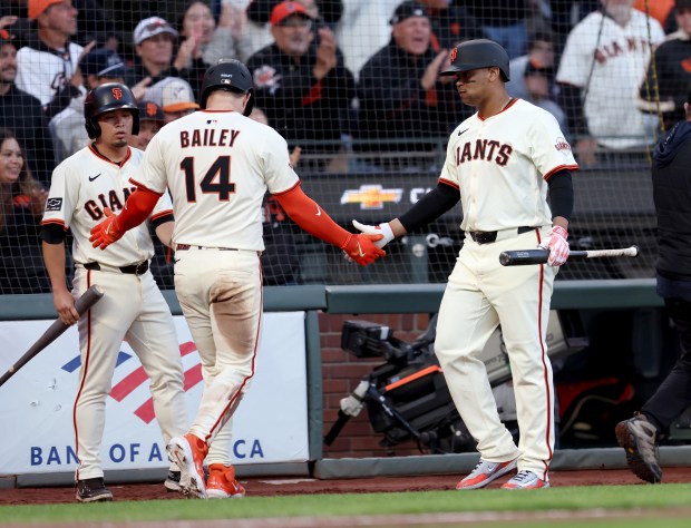San Francisco Giants’ Patrick Bailey #14 celebrates with teammate Rafael...