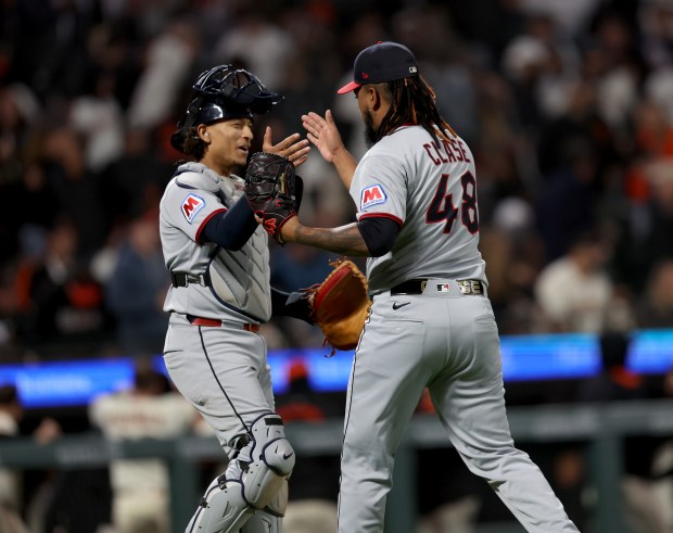 Cleveland Guardians’ pitcher Emmanuel Clase #48 and catcher Bo Naylor...