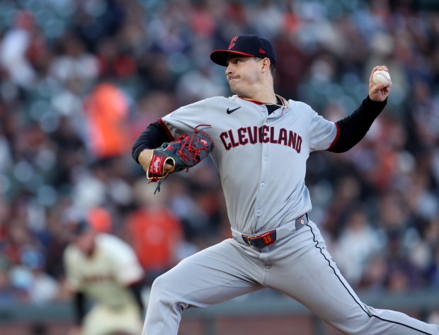 Cleveland Guardians starting pitcher Logan Allen #26 throws against the...