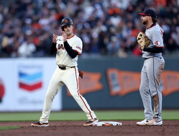 San Francisco Giants’ Mike Yastrzemski #5 celebrates as teammate Patrick...