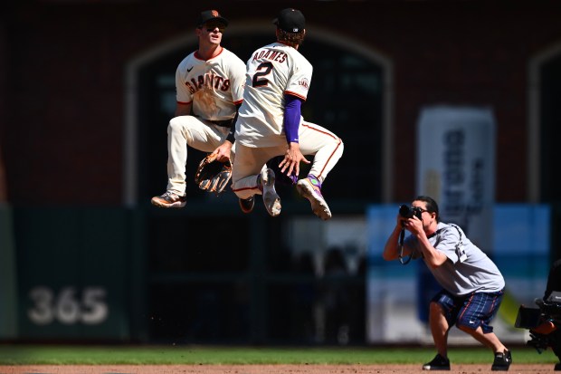 San Francisco Giants’ Mike Yastrzemski (5) celebrates with teammate Willy...