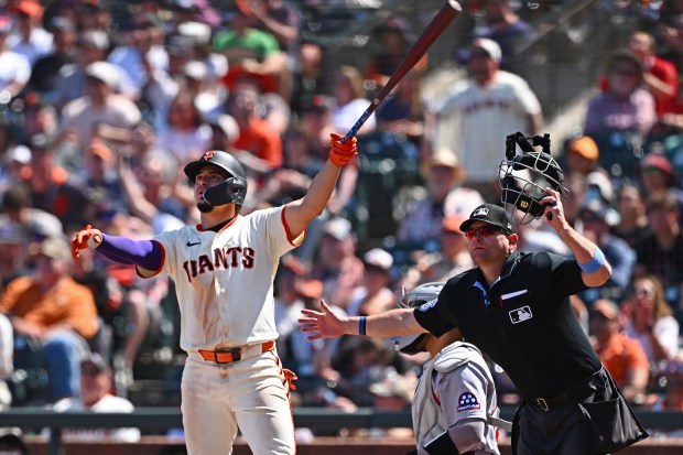 San Francisco Giants’ Willy Adames (2) watches the flight of...