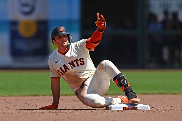 San Francisco Giants’ Casey Schmitt (10) gestures to the dugout...