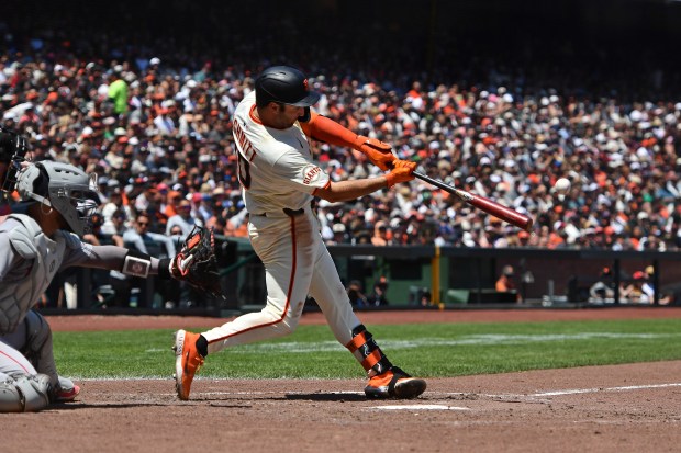 San Francisco Giants’ Casey Schmitt (10) connects for a solo...