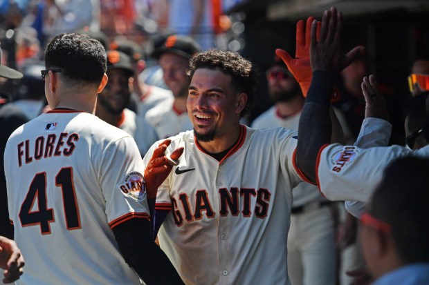 San Francisco Giants' Willy Adames (2) celebrates in the dugout after hitting a solo home run in the eighth inning of their MLB game at Oracle Park in San Francisco, Calif., on Sunday, June 22, 2025. The San Francisco Giants defeated the Boston Red Sox 9-5. (Jose Carlos Fajardo/Bay Area News Group)