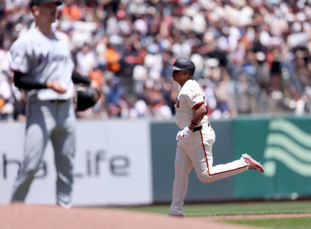 San Francisco Giants designated hitter Rafael Devers #16 rounds the...