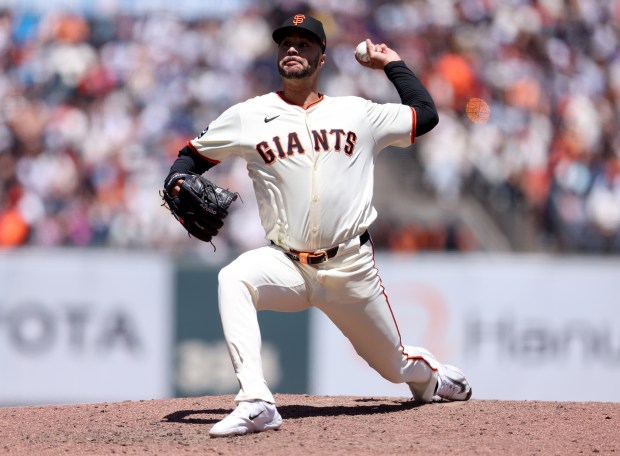 San Francisco Giants relief pitcher Joey Lucchesi #57 throws against...