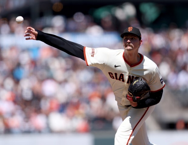 San Francisco Giants relief pitcher Sean Hjelle #64 throws against...