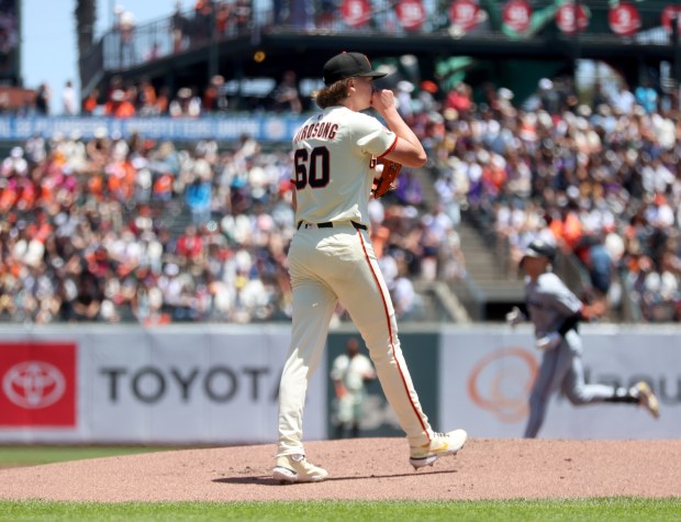 San Francisco Giants starting pitcher Hayden Birdsong #60 reacts as...