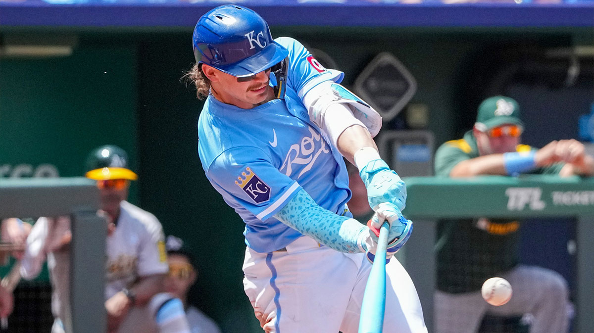 Kansas City Royals shortstop Bobby Witt Jr. (7) hits a single against the Athletics during the fifth inning of the game at Kauffman Stadium.