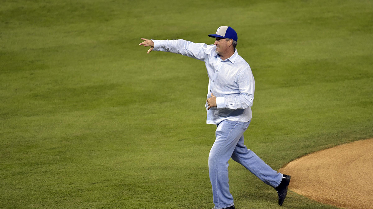 Kansas City Royals former pitcher Bret Saberhagen throws out the ceremonial first pitch before game seven of the 2014 World Series against the San Francisco Giants at Kauffman Stadium.