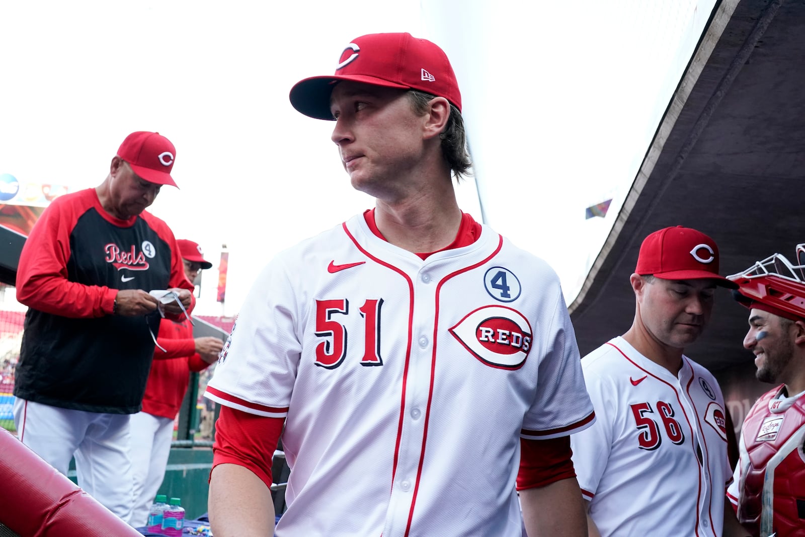 Cincinnati Reds pitcher Brady Singer (51) walks through the dugout prior to a baseball game against the Milwaukee Brewers, Monday, June 2, 2025, in Cincinnati. (AP Photo/Jeff Dean)