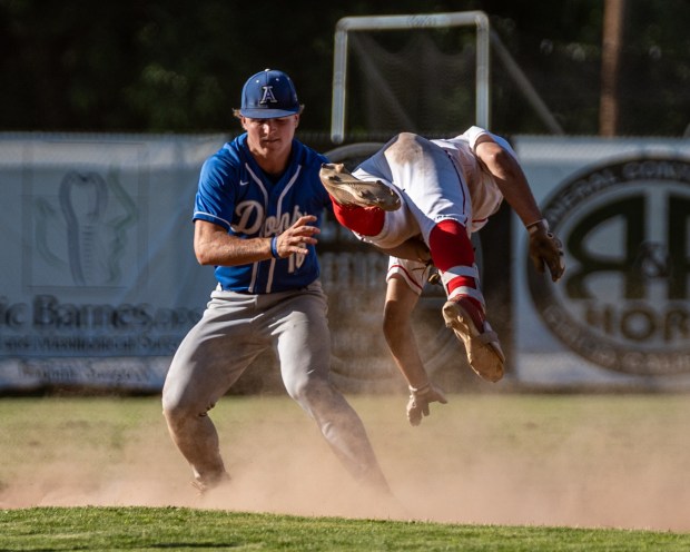 Chico High’s Jaden Neugebauer, right, dives for second base but...