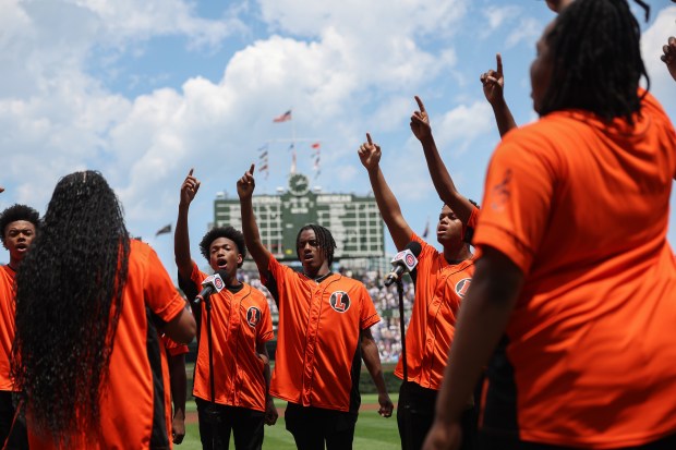 Members of the Leo Catholic High School choir perform "Lift Every Voice and Sing" before a Cubs-Brewers game at Wrigley Field on June 19, 2025, in Chicago. (John J. Kim/Chicago Tribune)
