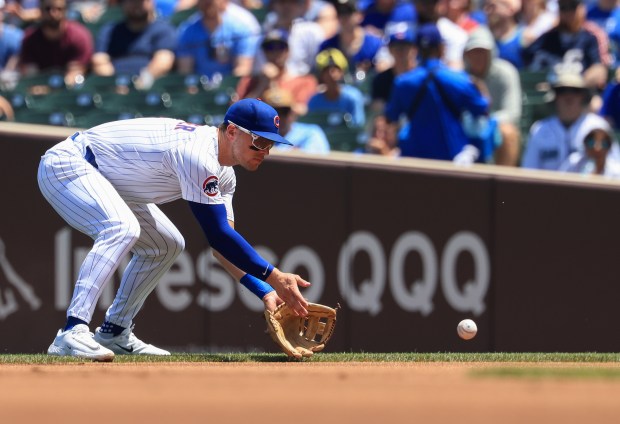 Cubs second baseman Nico Hoerner fields a grounder from Mariners shortstop J.P. Crawford in the first inning on June 21, 2025, at Wrigley Field. (John J. Kim/Chicago Tribune)