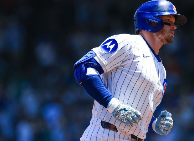 Cubs left fielder Ian Happ rounds the bases after hitting a home run against the Mariners in the first inning on June 21, 2025, at Wrigley Field. (John J. Kim/Chicago Tribune)