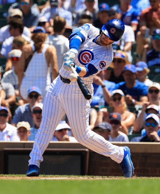 Cubs left fielder Ian Happ connects for a three-run home run against the Mariners in the second inning on June 21, 2025, at Wrigley Field. (John J. Kim/Chicago Tribune)