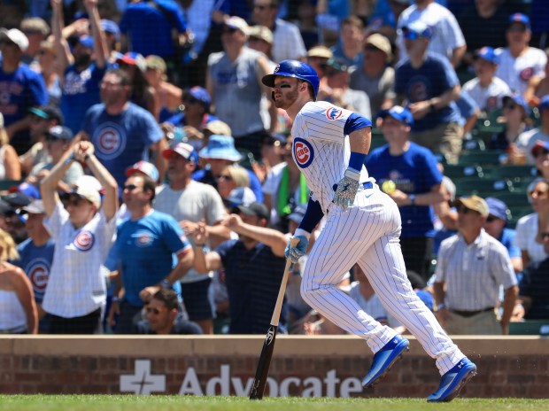 Cubs left fielder Ian Happ heads for the bases after hitting a three-run home run against the Mariners in the second inning on June 21, 2025, at Wrigley Field. (John J. Kim/Chicago Tribune)