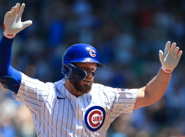 Cubs first baseman Michael Busch rounds the bases after hitting a three-run home run against the Mariners in the third inning on June 21, 2025, at Wrigley Field. (John J. Kim/Chicago Tribune)