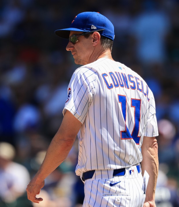 Cubs manager Craig Counsell heads to the mound to make a pitching change in the fifth inning against the Mariners on June 21, 2025, at Wrigley Field. (John J. Kim/Chicago Tribune)