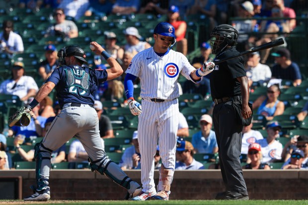 Cubs designated hitter Seiya Suzuki looks away as he is called out on strikes in the eighth inning against the Mariners on June 21, 2025, at Wrigley Field. Suzuki went 0-for-5 in the Cubs' 10-7 win. (John J. Kim/Chicago Tribune)