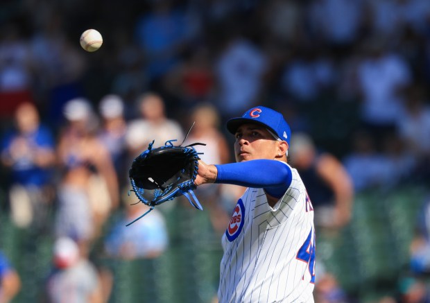 Cubs reliever Daniel Palencia retrieves the ball after giving up a home run to Mariners catcher Cal Raleigh in the ninth inning on June 21, 2025, at Wrigley Field. (John J. Kim/Chicago Tribune)