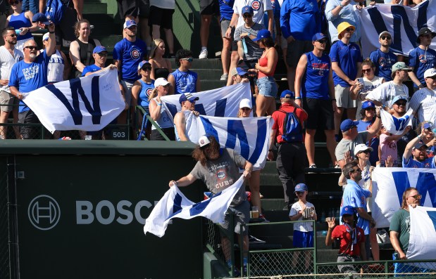 Fans celebrate a 10-7 Cubs win over the Mariners on June 21, 2025, at Wrigley Field. (John J. Kim/Chicago Tribune)