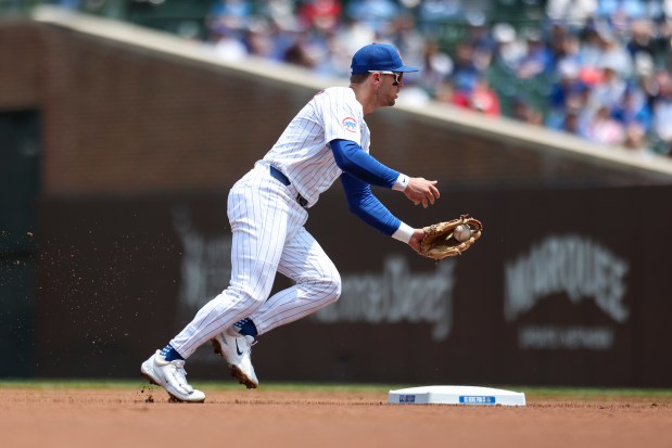 Chicago Cubs second baseman Nico Hoerner (2) fields a grounder during the first inning against the Cincinnati Reds at Wrigley Field on Sunday, June 1, 2025. (Eileen T. Meslar/Chicago Tribune)
