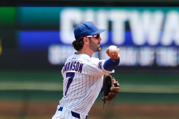 Chicago Cubs shortstop Dansby Swanson (7) throws to first base during the first inning against the Cincinnati Reds at Wrigley Field on Sunday, June 1, 2025. (Eileen T. Meslar/Chicago Tribune)