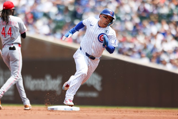 Chicago Cubs outfielder Seiya Suzuki (27) runs to third base on a hit from Chicago Cubs outfielder Pete Crow-Armstrong (4) during the first inning against the Cincinnati Reds at Wrigley Field on Sunday, June 1, 2025. (Eileen T. Meslar/Chicago Tribune)