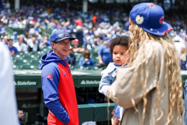 Chicago Cubs manager Craig Counsell (11) speaks to retired WNBA player Candace Parker as she walks onto the field to throw out the first pitch before the Chicago Cubs game against the Cincinnati Reds at Wrigley Field on Sunday, June 1, 2025. (Eileen T. Meslar/Chicago Tribune)