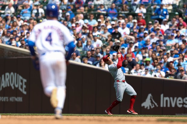 Cincinnati Reds second baseman Matt McLain (9) catches a pop fly as Chicago Cubs outfielder Pete Crow-Armstrong (4) runs back to second base during the fifth inning at Wrigley Field on Sunday, June 1, 2025. (Eileen T. Meslar/Chicago Tribune)