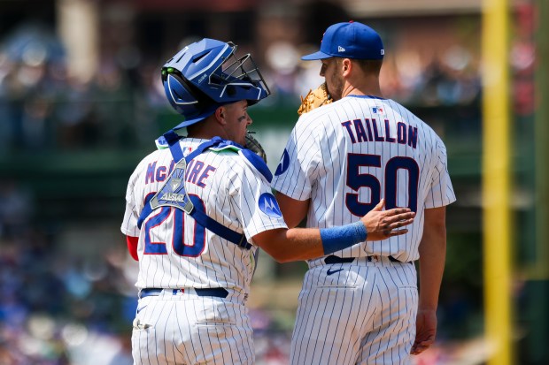 Chicago Cubs catcher Reese McGuire (20) speaks to Chicago Cubs pitcher Jameson Taillon (50) during the sixth inning against the Cincinnati Reds at Wrigley Field on Sunday, June 1, 2025. (Eileen T. Meslar/Chicago Tribune)