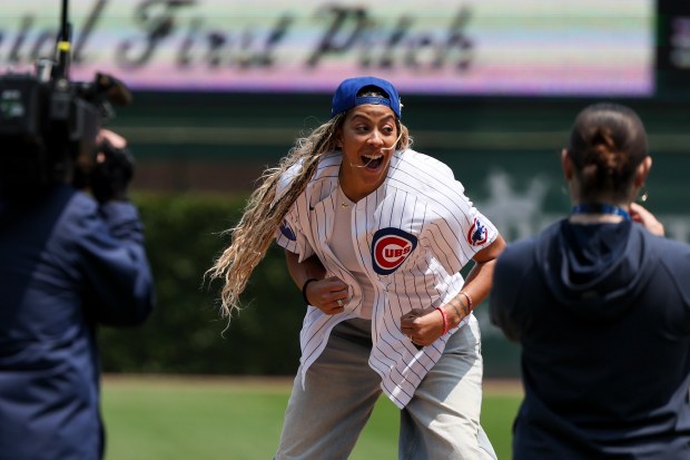 Retired WNBA player Candace Parker celebrates after throwing out the first pitch before the Chicago Cubs game against the Cincinnati Reds at Wrigley Field on Sunday, June 1, 2025. (Eileen T. Meslar/Chicago Tribune)