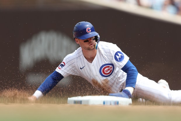 Nico Hoerner of the Cubs steals second base during the third inning against the Pirates on Saturday, June 14, 2025, at Wrigley Field. (Geoff Stellfox/Getty Images)