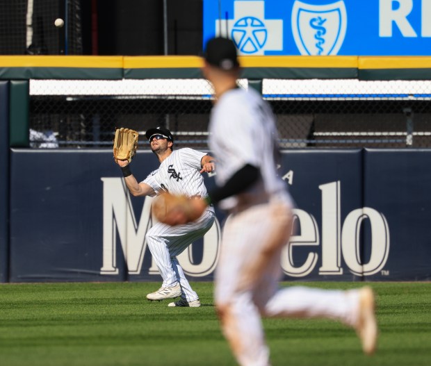 White Sox left fielder Andrew Benintendi catches a fly ball for an out in the seventh inning against the Giants on Saturday, June 28, 2025, at Rate Field. (John J. Kim/Chicago Tribune)