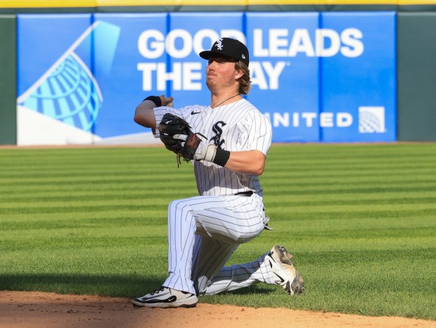 White Sox second baseman Chase Meidroth throws from one knee after fielding a grounder by Giants left fielder Heliot Ramos for an out in the ninth inning Saturday, June 28, 2025, at Rate Field. (John J. Kim/Chicago Tribune)
